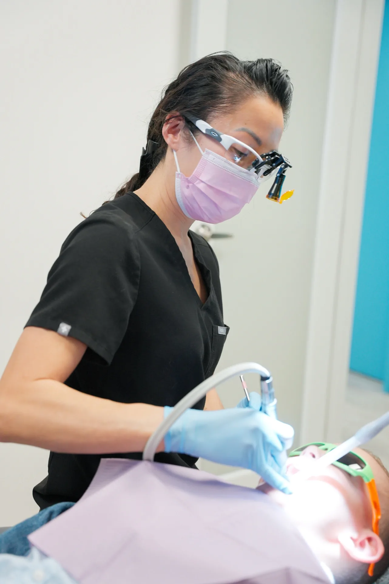 Oasis Dental clinician treating a patient during a procedure
