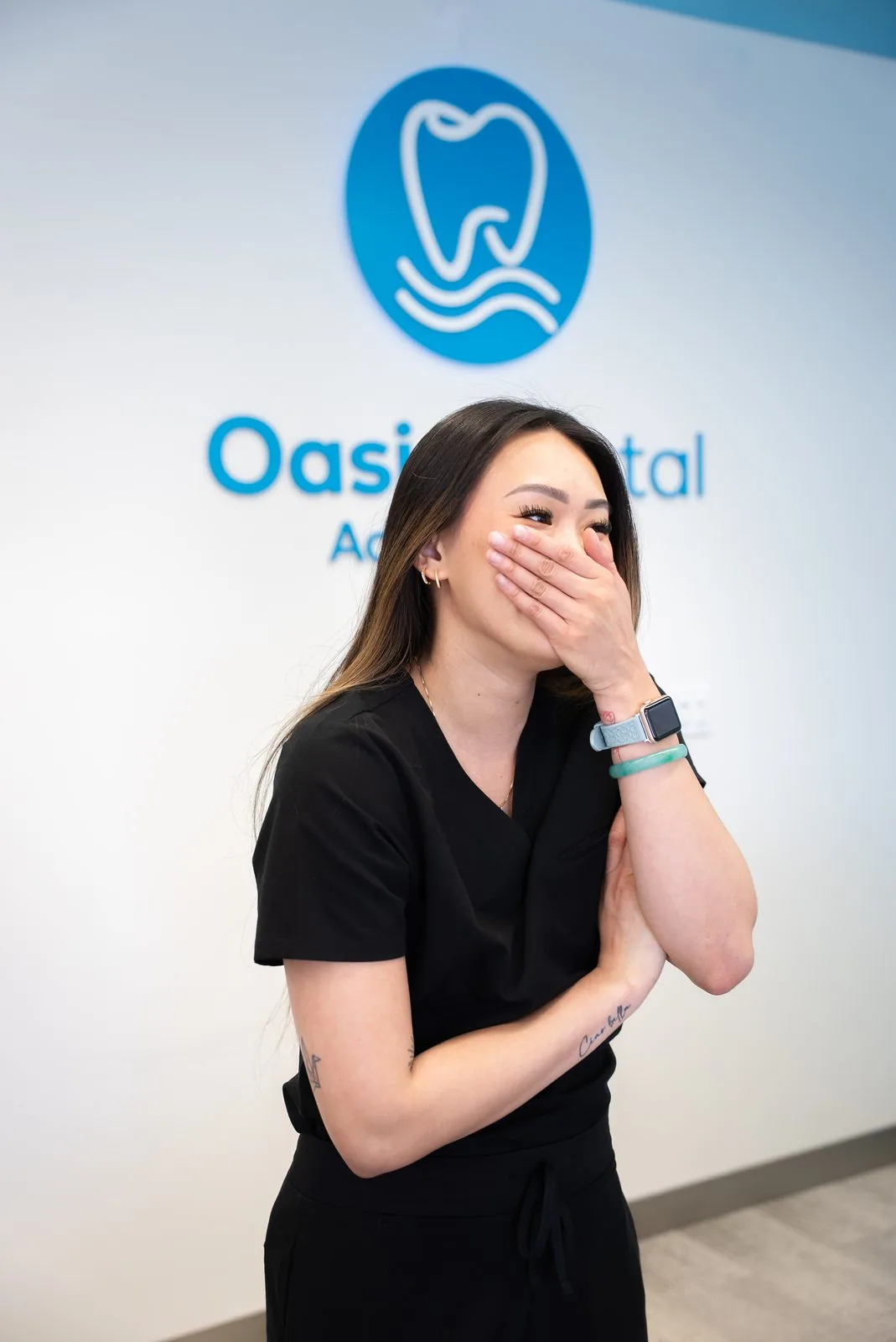 Dr. Amanda Ta laughing at Oasis Dental