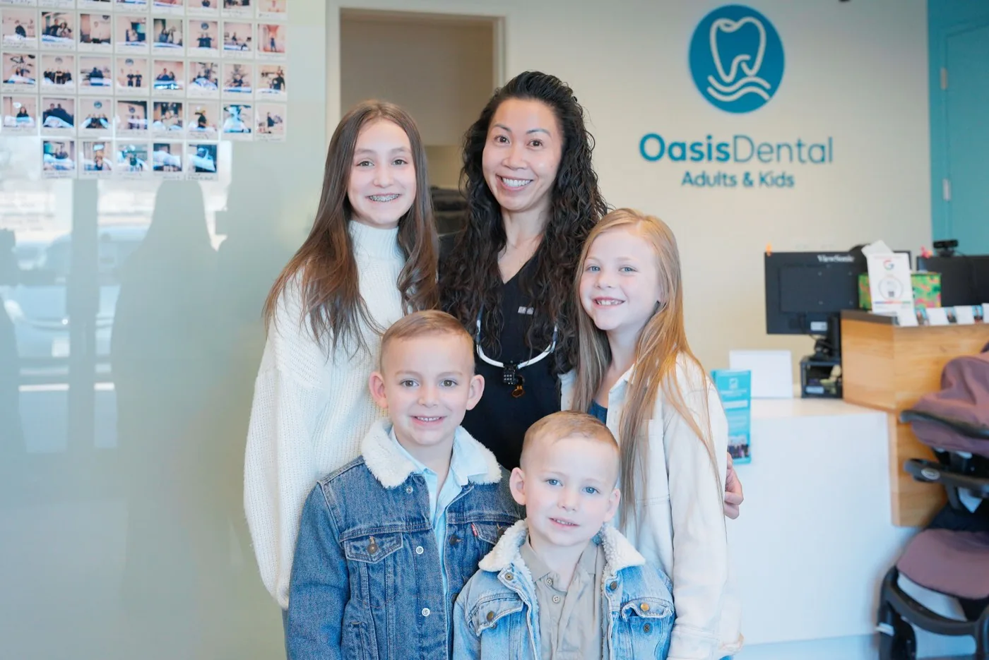 Oasis Dental doctor with young patients in Aurora, CO