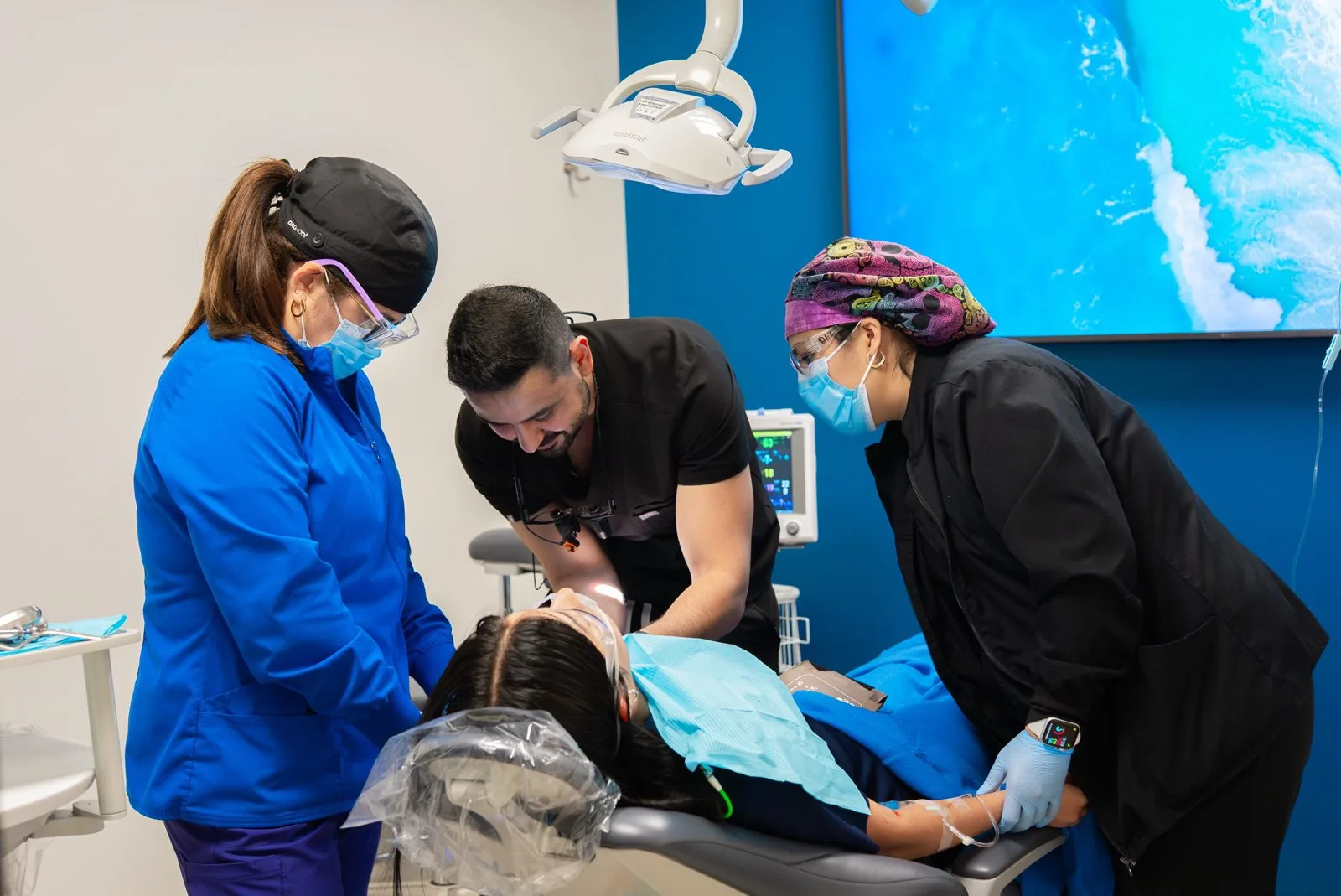 Oasis Dental care team performing a procedure together