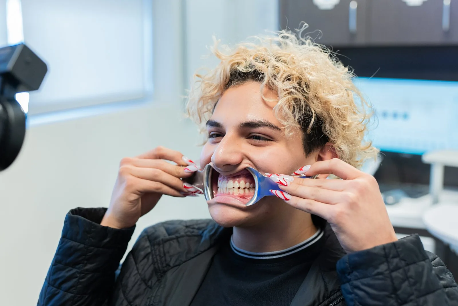 Oasis Dental patient laughing during a smile photo session